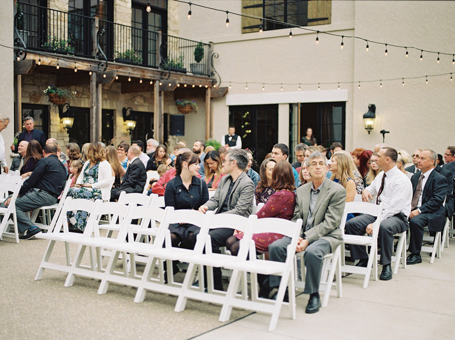 Ceremony guests, twinkle lights, Rainy Wedding Day, Silver Oaks Chateau Wedding, St Louis Wedding Photographer, Missouri Wedding Photographer, Film Wedding Photography, Fine Art Wedding, Destination Wedding Photographer, Ball Photo Co, Fall Wedding Inspiration, Castle Wedding Venue, Midwest Wedding, Old World Wedding Inspiration, Pentax 645N, Portra 800, Organic Berry Wedding, Berry tone color palette, Burgundy Forest Green Wedding